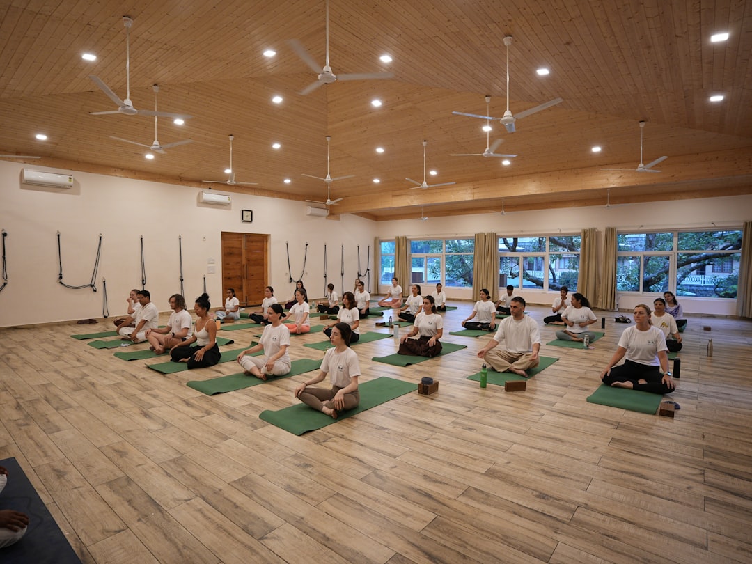 Group of people meditating in a yoga studio